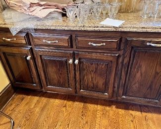 #N $1000) Kitchen Cabinet Sections (Lower Cabinets, Granite Countertop, Sink, Trash Cabinet, Dishwasher cutout, cabinets, and Drawers, spice Drawers). Beautiful Hardwood Cabinets with soft close drawer hardware and Upper Cap.  28 1/2 W x 20 D x 62 H.  Purchaser must remove on their own or with their own contractor help prior to March 31. 