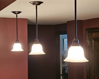#S $150) Wilson Lighting. Set of 3 Pendant Bar Lights.  7" D x 22" H. Purchaser must remove on their own or with their own contractor help prior to March 31. 