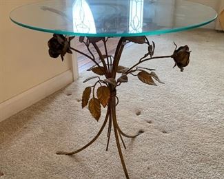 Glass and bronze toned accent table Rose base design