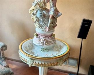 Large Capodimonte sculpture sitting on Lorenzon Italian ceramic table - shaped like birdbath with glass top.