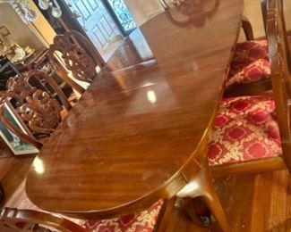 Dining table and 6 chairs. Shown with one leaf - two other leaves available. Also comes with table protector.