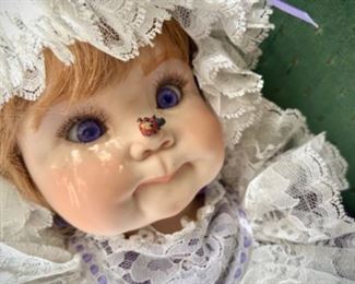 Mary Sides hand-made doll with ladybug on nose