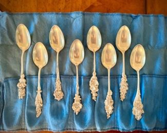 Reed & Barton sterling silver demitasse spoons with floral patterns on handles