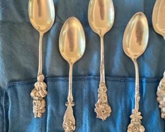 Reed & Barton sterling silver demitasse spoons with floral patterns on handles
