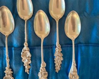 Reed & Barton sterling silver demitasse spoons with floral patterns on handles