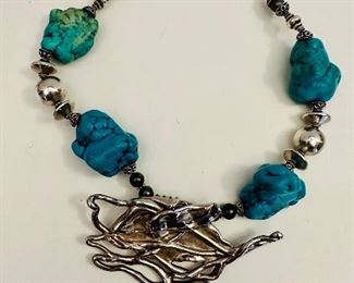 Statement turquoise and silver jewelry.