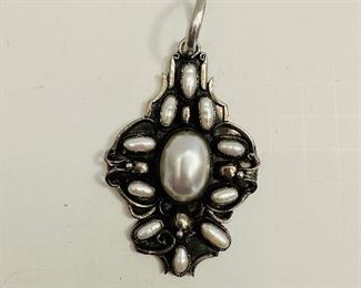 Pearl and silver pendant