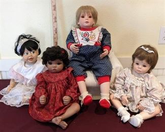 Four Sitting Baby Dolls