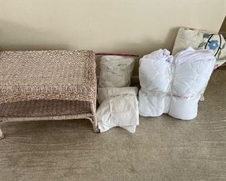 Wicker. table, king size sheets, bedding