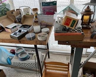 Handmade wood doll bench, multiple coaster sets, a box of knitting supplies, including knitting needles.