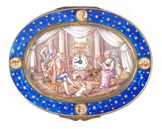 ENAMEL & SILVER AUTOMATA SNUFF BOX WITH WATCH  |  Oval box, c.1780/1800. The panels on cover, sides and base enamel in translucent blue on a ground of wavy scalloped reeded engine-turning creating a moir� aspect. There are gold star�s on top of the blue enamel with hand painted portraits. The lid set central hand painted enamel picture with two men with a dog along with a woman sitting next to a spinning wheel. The wheel is the automata. The watch is set in the middle of the picture. There is glass over the central painting. All along the side and the bottom are more hand painted enameled paintings. 3 in. (76 mm.) wide
N.B. Descriptions are revised from a 1994 insurance appraisal by a noted N.Y.C. auction house Horologist
