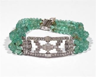 ART DECO DIAMOND & EMERALD TRIPLE STRAND BRACELET | Having an openwork art deco form plaque set with emerald cut and baguette cut diamonds with hinged articulating bails connected to triple strands of melon-carved emerald beads; approx. 7 in., 28.0g