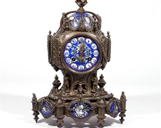FRENCH RENAISSANCE REVIVAL MANTEL CLOCK | Mid-late 19th century, likely by Howell & James of Paris, bronze and enameled porcelain with heraldic devices of a knight and arms, having a domed top and with chain decorations, the works apparently unmarked
h. 13 w. 9 d. 6 in.