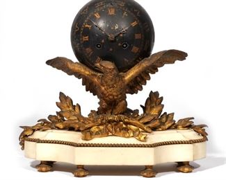 BROCOT & DELETTREZ EAGLE BALL CLOCK  |  French, mid 19th century, designed as a black painted ball-form clock decorated with gold stars resting on a chased gilt bronze eagle with spread wings clutching garlands and ribbons resting on a marble base; movement marked "A. Brocot & Delettrez, Paris"
h. 13 w. 15 d. 6 in.

Antoine (Jean-Baptiste) Delettrez and Achille Brocot, son of the respected clockmaker Louis-Gabriel Brocot, established the clockmaking company "Brocot et Delettrez" in Paris on 20 October 1851, with premises at 62 Rue Charlot.[1] Delettrez worked alongside Achille Brocot for several years and their clock movements are considered to be the most effective made during the late 19th century. The firm was awarded a 1st class prize at the Paris World Exposition of 1857

Antoine (Jean-Baptiste) Delettrez and Achille Brocot, son of the respected clockmaker Louis-Gabriel Brocot, established the clockmaking company "Brocot et Delettrez" in Paris on 20 October 1851, with premises at 