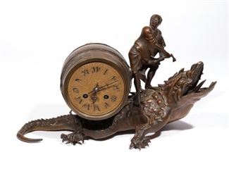 OTTO VAN MEURS BRONZE FIGURAL CLOCK  |  A patinated bronze figural clock in the Japanese taste, modeled as a man with a large barrel on top of a dragon, works signed "Otto Van Meiors" [sic]
h. 9 w. 15 d. 8 in.

N.B. Descriptions are revised from a 1994 insurance appraisal by a noted N.Y.C. auction house Horologist