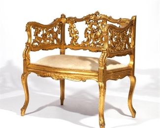 AESTHETIC MOVEMENT GILT CARVED ARMCHAIR | Overall rocaille carving
h. 29 w. 24-1/2 d. 19 in.