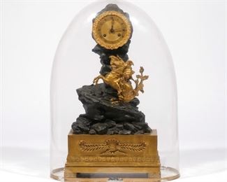 FRENCH RESTORATION FIGURAL MANTEL CLOCK | 19th century, in patinated and dor� bronze, with a figure of Napoleon on horseback, works marked "Beaupre"; having a glass dome bell cover no wooden base
h. 16-1/2 w. 9 d. 4-3/4 in.
overall: approx. h. 17 (bell)