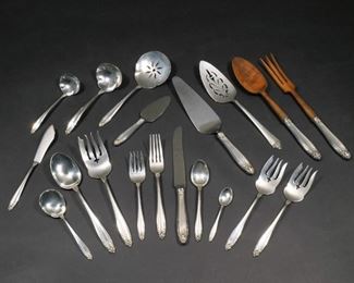 (75PC) INTERNATIONAL STERLING FLATWARE SET | Including silver chest and stand, in "Prelude" pattern, service for twelve comprising: 12 knives, 12 forks; 12 dessert forks; 24 teaspoons; plus serving pieces, including 3 serving forks, 2 ladles, 4 misc. spoons, a pair of salad servers, and 4 knives / cake servers; total weighable silver 78.63 ozt