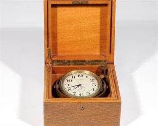 RARE PATEK PHILIPPE CHRONOMETER | A gimbal mounted naval chronometer in brass, with silvered enamel face, signed "PATEK PHILIPPE & CO. / GENEVE / CHRONO | METER", in fitted wood box
h. 4-1/4 w. 6-1/8 d. 6 in. (box)
N.B. Descriptions are revised from a 1994 insurance appraisal by a noted N.Y.C. auction house Horologist