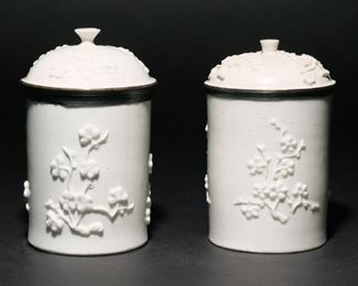 (2PC) MENNECY WHITE TOBACCO JARS, C. 1750-60 | With silver mounted covers and chinoiserie embossed decoration, with "The Antique Porcelain Co. Inc, NY" labels, incised D, V marks.
h. 6 in. (tallest)