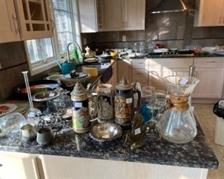 Large collection of beer steins, vases, glassware