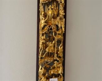 Carved wood hanging art piece