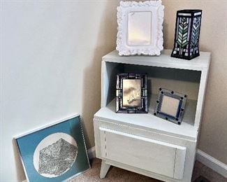Modern nightstand, antique lace, and stained glass picture frames