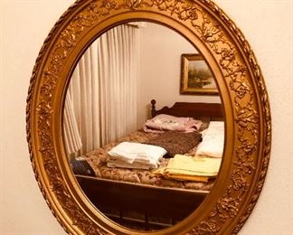 Old gilt oval mirror (19” x 23”)