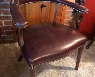 One of 4 leather & wood captains chairs with nailhead trim - made by Classic Leather