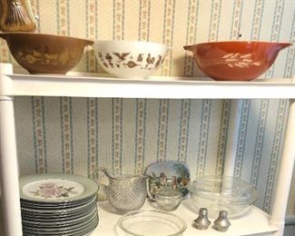 Pyrex mixing bowls, lots of Pyrex pie plates, pretty Noritake plates with roses 