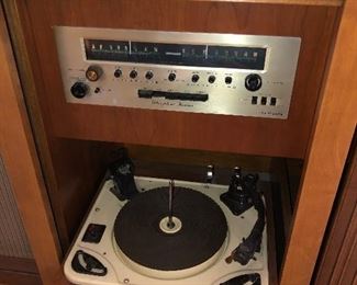 Close up of stereophonic receiver & record player - both radio & record player work. Both speakers work, but we disconnected right one because wire to it is super brittle.