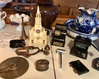 Lighted plastic church/music box by Raylite, vintage Uncle Sam’s register bank, Universal 109 coffee mill, single spur & cymbal, Flow Blue pitcher & bowl