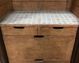 two plain drawers two fitted to hold bottles. Dimensions and price are listed in the first photo description.