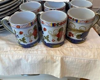 $100. Set of 9 Italian pottery mugs