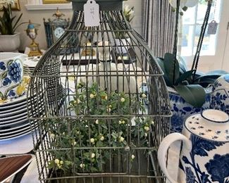 $28. Birdcage with faux plants