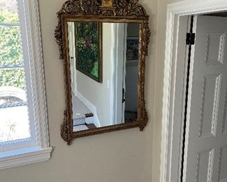 $790. Antique gilded mirror with carved eagle detail at the top. 57.5"h x 35" w.