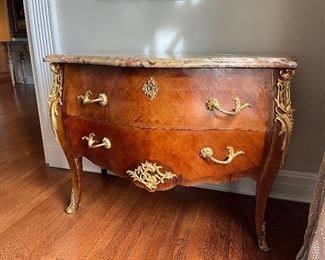 $1400. Antique Tulipwood and Kingwood Serpentine Bombe Commode with a marble top. 19th century originally purchased from David Weatherford. Items on top not included in the sale. 44.5"w x 21.75"d x 32"h.