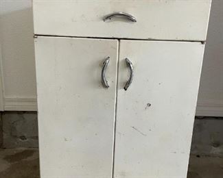 White Metal Cabinet  with drawer.                                                        24"W 20"D 36"T                                                                                                  $45.00                                                                           