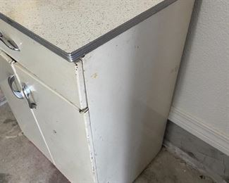 White Metal Cabinet  with drawer.                                                        24"W 20"D 36"T                                                                                                  $45.00     