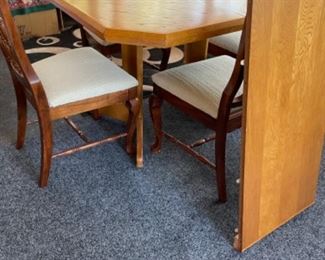 Wooden kitchen table w leaf & 4 chairs.   Table: 42”w 42”d 30”t. Leaf: 18”w 42”d.   Chairs: 19”w 17”d 38” t, 18” flr to seat.     $125.00