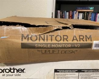 (2) monitor arms.   One in box, one assembled.  $25.00 each