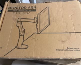 (2) monitor arms.   One in box, one assembled.  $25.00 each