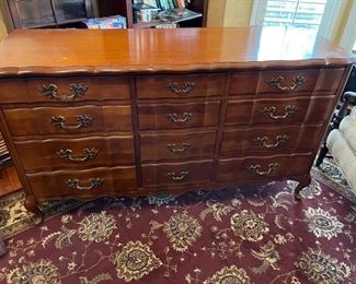 Antique cherry dresser that comes with mirror and also has two matching nightstands