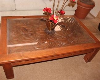 Wood carved top coffee table with glass top