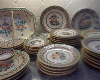 Mexican pottery from Puebla in popular green and orange design.