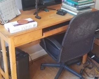 Solid wood desk; executive office chair; monitor