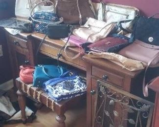 Ladies vanity table; large assortment of purses and handbags - Vera Bradley, Anuschka, etc.
