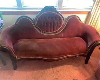 Antique Victorian Couch
Fabric is faded and has some scratches. 
Most likely needs to be recovered. 
Wood and structure is in great shape.
70” long x 21” deep x 14” tall to seat, 43” tall to back.
Must be able to move and load yourself.
