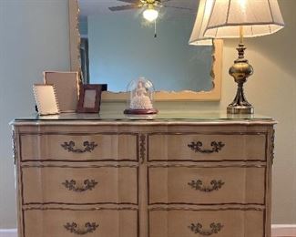 Bedroom #1:  The LAMMERT's French Provincial six-drawer dresser (53" wide x 21" deep  35" tall) has a protective glass top. The mirror is priced with the dresser.  The photo frames, figure under glass, and lamp are separately priced.   