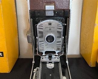 Dining Room:  This vintage POLAROID Land Camera Model 95A is from the 1950's and quite collectible!